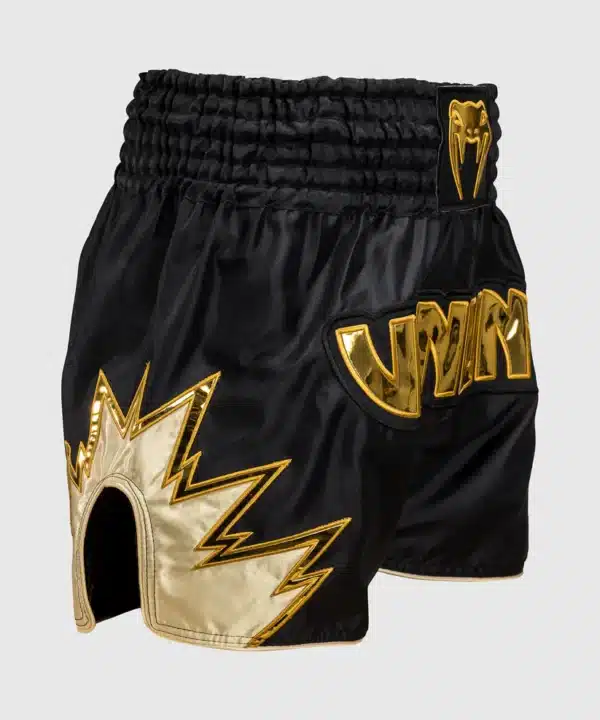 מכנס איגרוף תאילנדי Venum Inferno Muay Thai Shorts - Black/Gold