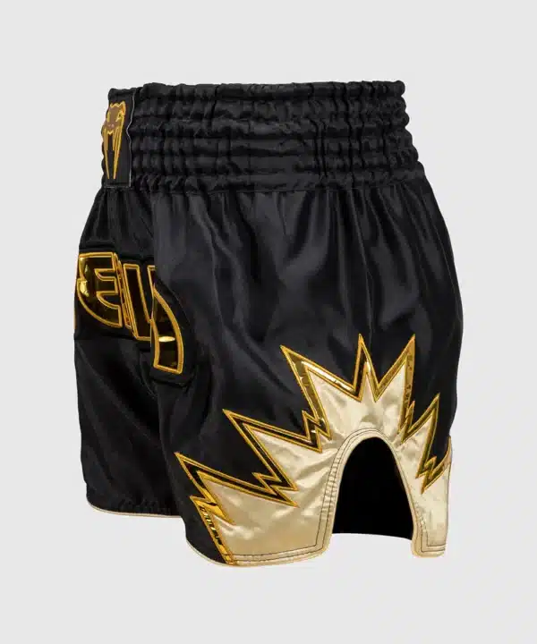 מכנס איגרוף תאילנדי Venum Inferno Muay Thai Shorts - Black/Gold