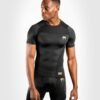 חולצת Venum G-Fit Rashguard - Short Sleeves שחור זהב