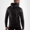 ⁦קפוצ׳ון ונום UFC שחור לבן - UFC VENUM AUTHENTIC FIGHT NIGHT MEN'S WALKOUT HOODIE - BLACK⁩ – תמונה ⁦3⁩