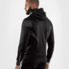⁦קפוצ׳ון ונום UFC שחור לבן - UFC VENUM AUTHENTIC FIGHT NIGHT MEN'S WALKOUT HOODIE - BLACK⁩ – תמונה ⁦5⁩