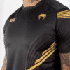 ⁦חולצת ונום UFC שחורה- UFC VENUM AUTHENTIC FIGHT NIGHT MEN'S WALKOUT JERSEY - CHAMPION⁩ – תמונה ⁦4⁩
