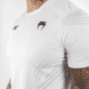 ⁦חולצת אימון ונום UFC לבנה - UFC VENUM AUTHENTIC FIGHT NIGHT MEN'S WALKOUT JERSEY - WHITE⁩ – תמונה ⁦4⁩