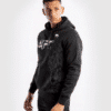 ⁦קפוצ׳ון ונום UFC שחור-UFC VENUM AUTHENTIC FIGHT WEEK MEN'S PULLOVER HOODIE - BLACK⁩ – תמונה ⁦3⁩