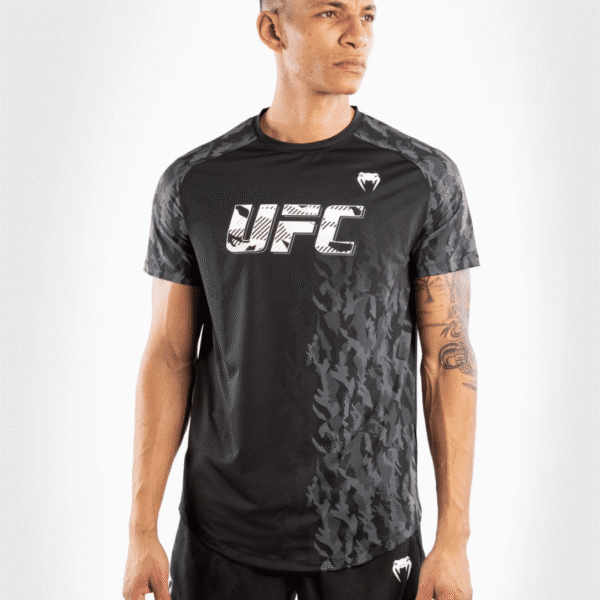 חולצת ונום UFC שחורה -UFC VENUM AUTHENTIC FIGHT WEEK MEN'S PERFORMANCE SHORT SLEEVE T-SHIRT - BLACK