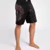 ⁦מיכנס לחימה של ונום - Venum Santa Muerte 5.0 Men’s Fight Shorts - Deep Black/Gold⁩ – תמונה ⁦4⁩