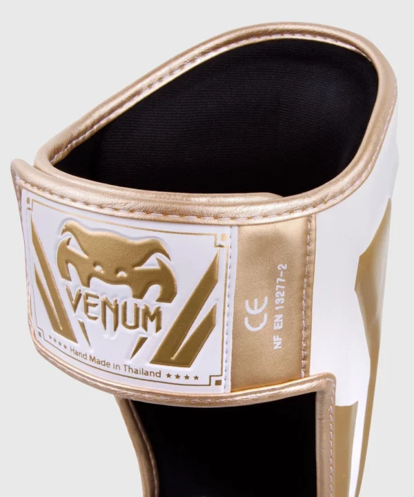 [Venum Elite Shinguards] White/Gold - מגני רגליים ונום אליט