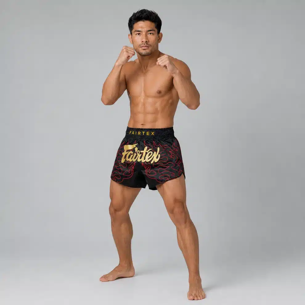 מכנסי מואי תאי Fairtex Lava BS1920 שחור עם להבות אדומות וכיתוב זהב