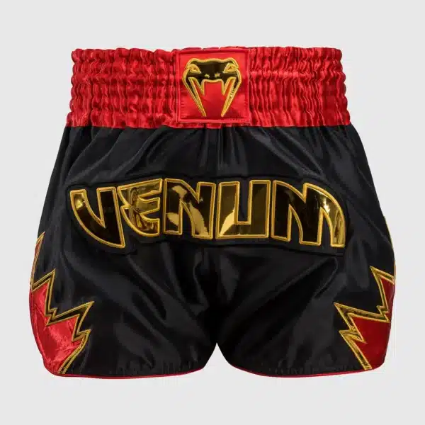 מכנס איגרוף תאילנדי Venum Inferno Muay Thai Shorts - Black/Gold/Red