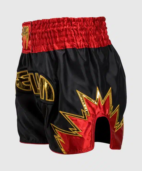מכנס איגרוף תאילנדי Venum Inferno Muay Thai Shorts - Black/Gold/Red
