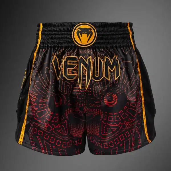 מכנסי איגרוף תאילנדי ונום Quetzal Fury Muay Thai – בצבעים שחור אדום וכתום