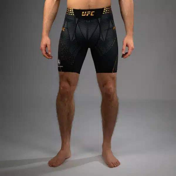 מכנסי לחימה ונום UFC מסוג קומפרשיין שחור וזהב מקולקציית UFC Zenith